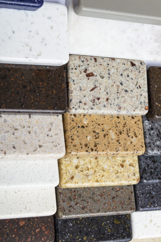layout colorful specimens granite marble quartz natural stone slabs close up stone kitchen countertops samples