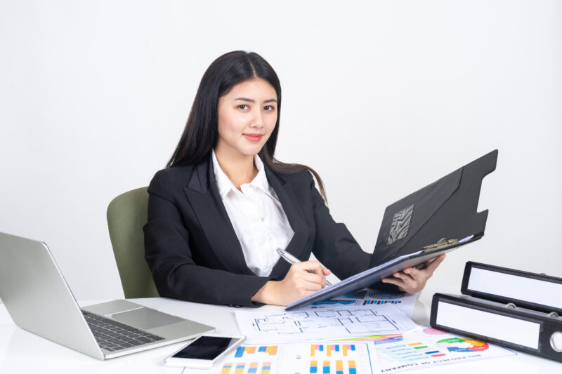 lifestyle beautiful asian business young woman using laptop computer smart phone office desk